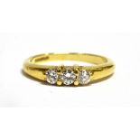 A DIAMOND THREE STONE 18CT GOLD RING The three round brilliant cut diamonds weighing a total of