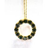 A MODERN GREEN DIAMOND 9CT GOLD PENDANT AND CHAIN The circular hoop pendant claw set with a total of