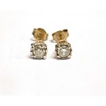 A PAIR OF SMALL DIAMOND SOLITAIRE STUD EARRINGS the two round brilliant cut diamonds weighing a