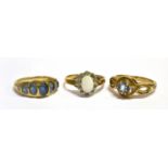 THREE 9CT GOLD DRESS RINGS Comprising an oval type 5 stone with tiny diamond shoulders, an opal