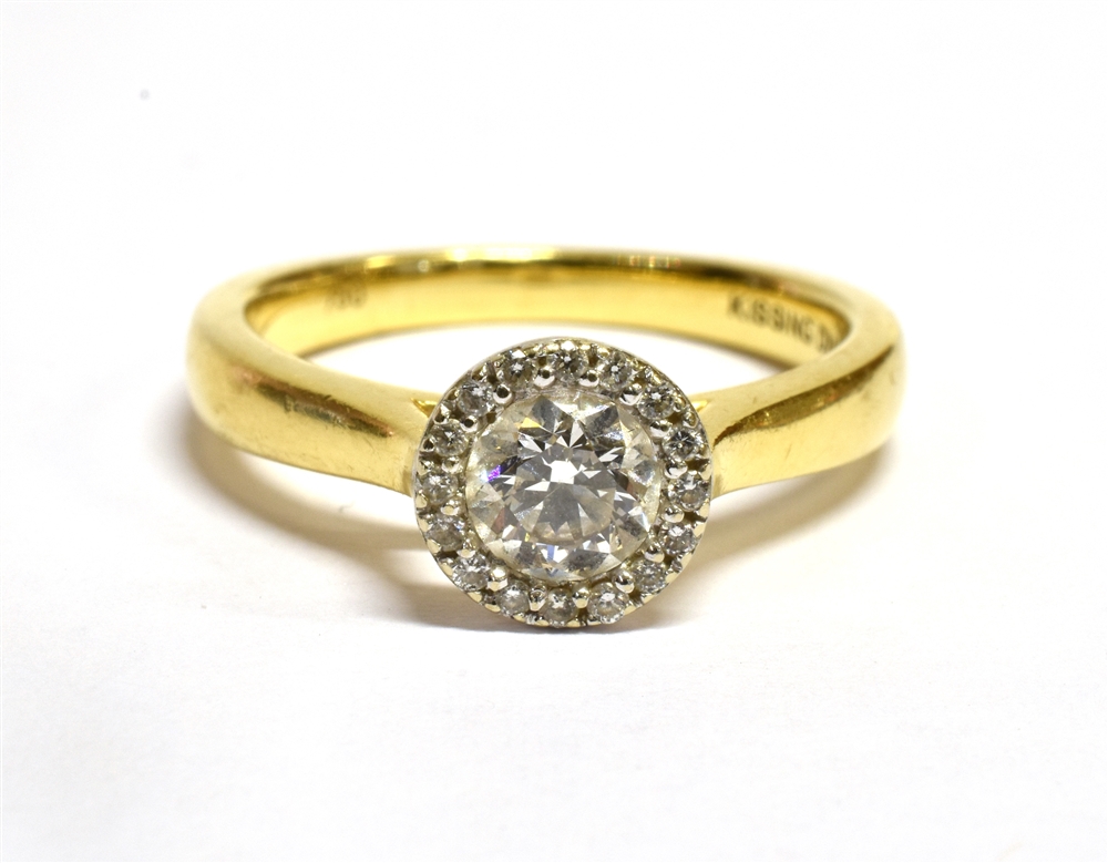 A HALF CARAT DIAMOND RING with halo cluster surround the central round brilliant cut diamond approx.