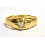 AN EDWARDIAN DIAMOND SOLITAIRE GYPSY RING The square old cut diamond approx. 4mm square weighing
