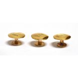 A GENTS BOXED SET OF THREE 9CT GOLD DRESS STUDS The plain small round studs hallmarked 1958,