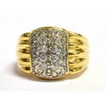 AN 18CT GOLD CUBIC ZIRCONIA SET SIGNET RING The front stone set lozenge shaped head to grooved
