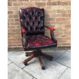 RED LEATHER ADJUSTABLE BUTTON BACK SWIVEL CHAIR, raised on central column out swept lets with