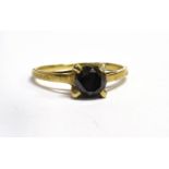 A BLACK DIAMOND SOLITAIRE 9CT GOLD RING The round brilliant cut black diamond weighing approx. 0.