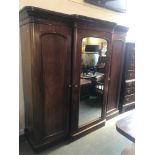 VICTORIAN MAHOGANY BREAKFRONT FITTED WARDROBE, having a moulded cornice over a mirrored central