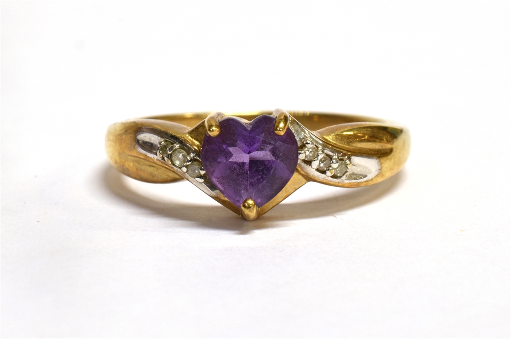 A HEART SHAPED AMETHYST SET 9CT GOLD RING with diamond set twist shoulders, size O, gross weight