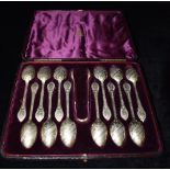 A CASED SET OF ELKINGTON & CO TEASPOONS AND TONGS The 12 silver gilt teaspoons with sugar tongs with
