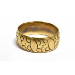 AN 18CT GOLD PATTERNED WEDDING BAND 7mm wide engraved pattern decoration, hallmarked 18ct gold, size