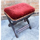 VICTORIAN MAHOGANY ADJUSTABLE PIANO STOOL, with a red upholstered seat with curved x- frame supports