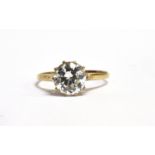 A CUBIC ZIRCONIA SOLITAIRE 9CT GOLD DRESS RING The large CZ 7.5mm dimeter claw set to hallmarked 9ct