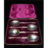 A CASED SET OF FOUR SILVER APOSTLE SPOONS The apostle tops to barley twist stems and plain oval