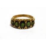 A GREEN TOURMALINE FIVE STONE 9CT GOLD RING