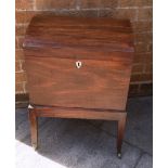 VICTORIAN MAHOGANY CELLARETTE, the hinged domed top opening to reveal fitted compartments within,