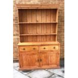 VICTORIAN PINE DRESSER, with a two shelf plate rack with panelled back above a base with two drawers