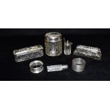 THREE SILVER TOPPED GLASS DRESSING TABLE JARS Comprising a round powder jar and 2 low rectangular