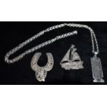 THREE ITEMS OF SILVER JEWELLERY Comprising an Egyptian Onyx set oblong pendant with gold covered