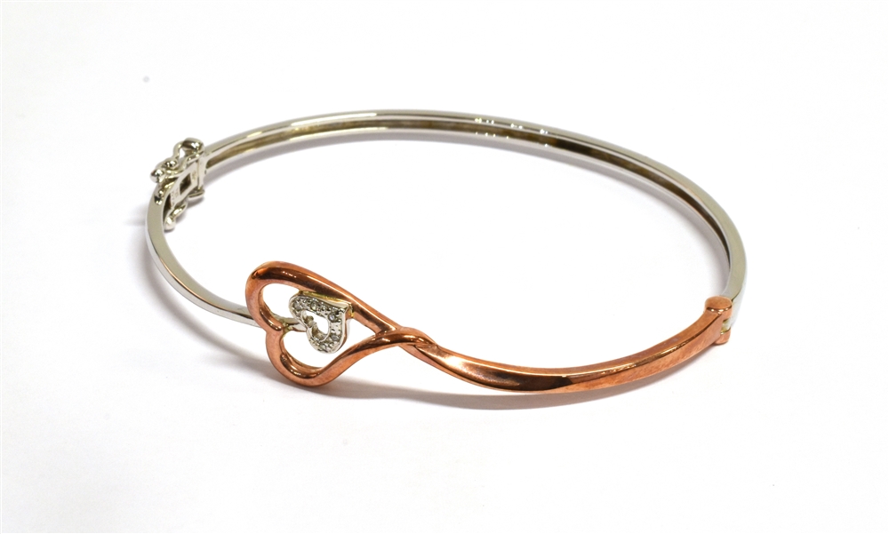 A 9CT ROSE AND WHITE GOLD HEART BANGLE the double heart openwork front set with very small - Image 2 of 4