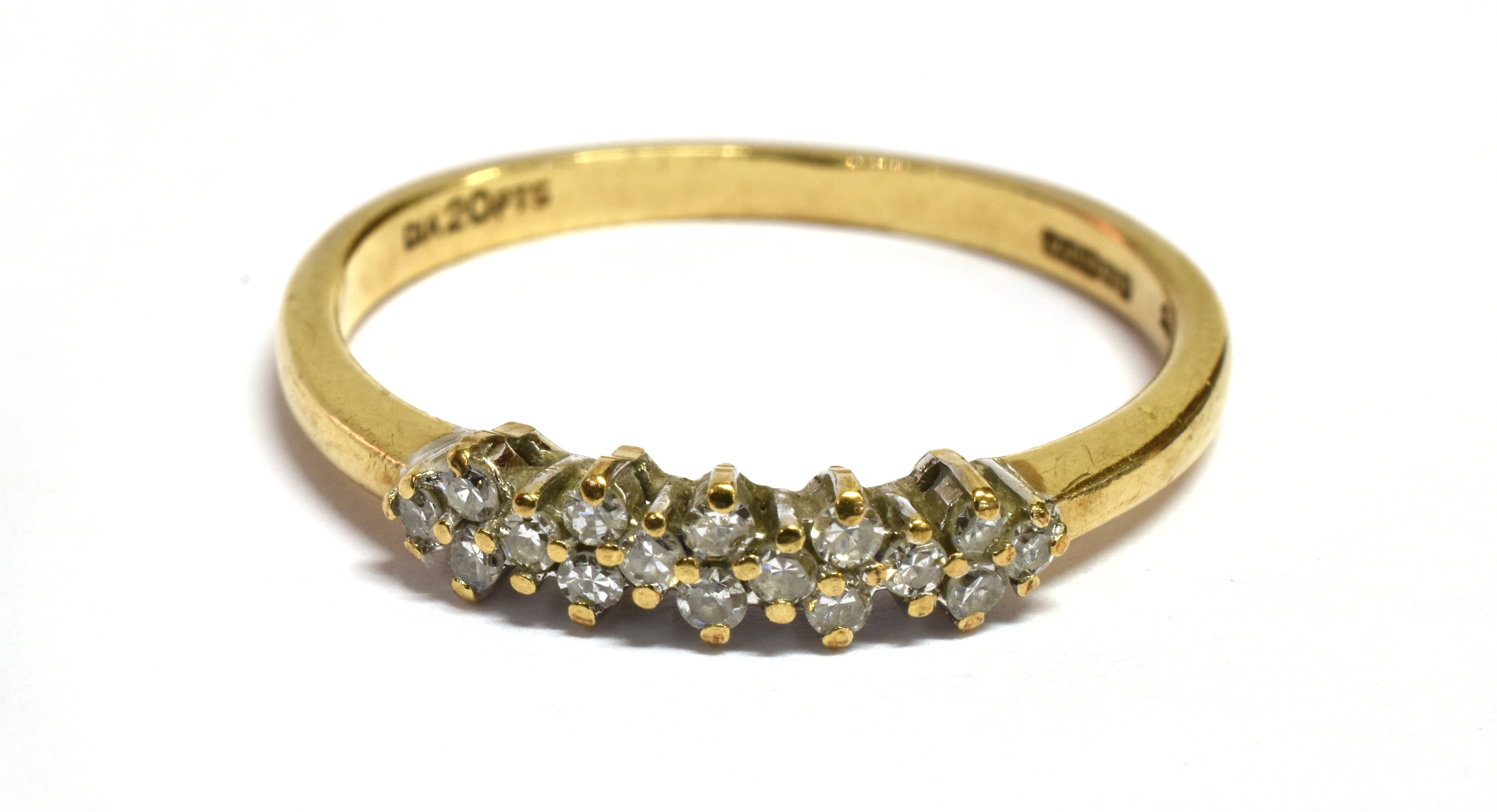 A DIAMOND SET 9CT GOLD RING The front claw set head comprising 16 small single cut diamond with a