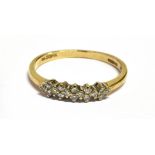 A DIAMOND SET 9CT GOLD RING The front claw set head comprising 16 small single cut diamond with a