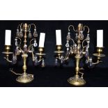 A PAIR OF TWO-LIGHT GILT METAL TABLE LAMPS with clear and coloured glass drops 30.5cm high Condition