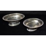 A PAIR OF SILVER BON BON DISHES One large, one small of oval shape pierced decoration on pierced