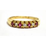 A MODERN RUBY AND DIAMOND SEVEN STONE RING Four small round cut rubies and three small cut