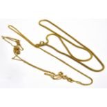 THREE 9CT GOLD CHAINS Comprising a snake link chain, 16 inches long ; and two fine curb link chains,