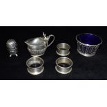 FIVE ITEMS OF SILVER WARE Comprising a mustard with glass liner (liner cracked) a pepperette, a pair