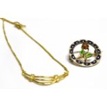 A LATE VICTORIAN ENAMELLED SILVER AND GOLD BROOCH Together with a 9ct gold pendant and chain, the