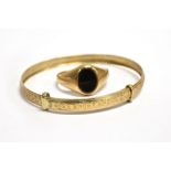 TWO ITEMS OF 9CT GOLD JEWELLERY comprising a small onyx set signet ring, size K ½ and a baby
