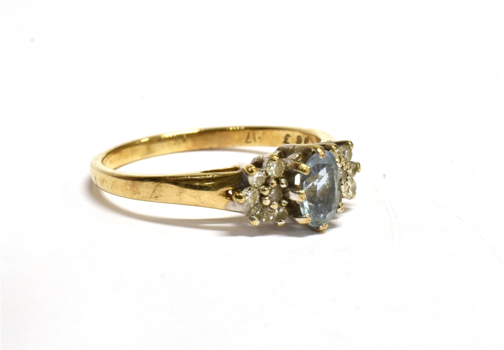 AN AQUAMARINE AND DIAMOND SET GOLD RING the central oval cut aquamarine approx. 6 x 4mm with six - Image 2 of 5