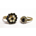 TWO SAPPHIRE SET 9CT GOLD DRESS RINGS Comprising an oval and Sapphire and small diamond cluster both