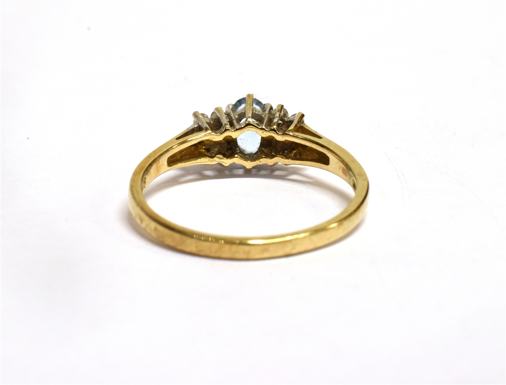 AN AQUAMARINE AND DIAMOND SET GOLD RING the central oval cut aquamarine approx. 6 x 4mm with six - Image 5 of 5