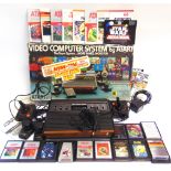 AN ATARI VIDEO COMPUTER SYSTEM (not tested), boxed, the box worn; together with a Popy-Bandai God