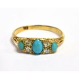 A LATE VICTORIAN/EDWARDIAN TURQUOISE THREE STONE RING The central oval turquoise 5 mm x 4 mm, with