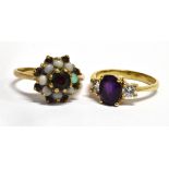 TWO GARNET SET 9CT GOLD DRESS RINGS Comprising a garnet and white three stone ring, size M; and a