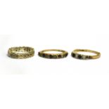 THREE 9CT GOLD DRESS RINGS Comprising two white and blue stone, half eternity rings and a white
