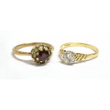 TWO 9CT GOLD DRESS RINGS Comprising a white stone solitaire, size O; and a garnet and white stone