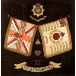 A SILKWORK PICTURE OF THE BADGE & COLOURS OF THE DEVONSHIRE REGIMENT (11TH REGIMENT OF FOOT) circa