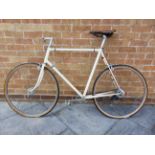 A GENTLEMAN'S RACING OR TOURING BICYCLE believed to be by Claud Butler, repainted cream, the 62cm (