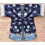 A CHINESE EMBROIDERED SILK ROBE OR LIGHT SURCOAT probably late 19th or early 20th century, with