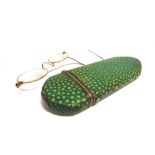 A LATE 18TH CENTURY SHAGREEN SPECTACLES CASE with silver coloured metal mounts and remains or