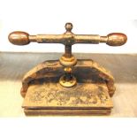 A CAST IRON & BRASS PORTABLE BOOK PRESS painted black, the pressing plate area 31cm x 45.5cm.
