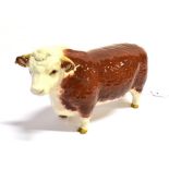 A BESWICK FIGURE OF A HEREFORD BULL. Ht 12 cm