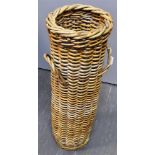 A CYLINDRICAL WICKER COACHING UMBERELLA HOLDER with twin carrying handles. Diameter 23cm, Height
