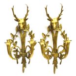 A PAIR OF CONTINENTAL BRASS TWIN BRANCH WALL SCONCES in the form of a pair of French Hunting Horns