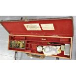 A RECTANGULAR LEATHER GUN CASE by William Powell & Son, Birmingham, with brass mounts and with