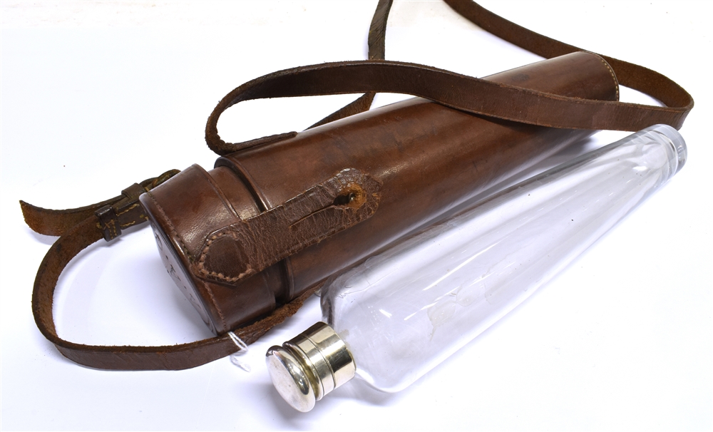 A TAPERED GLASS FLASK with plated flip top, in leather case with shoulder strap, length of case,